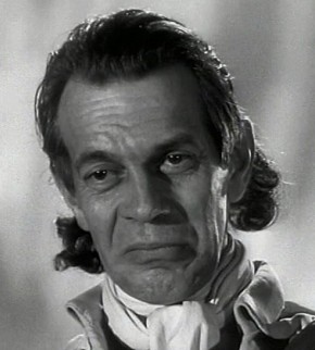 The Prosecutor - played by Raymond Massey